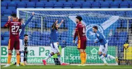  ?? ?? Stevie May, centre, celebrates after Drey Wright put Saints ahead