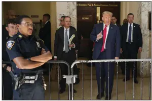  ?? (AP/Seth Wenig) ?? Former President Donald Trump stops to speak to the media Tuesday during a break in his civil business fraud trial at New York Supreme Court in New York.