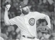  ?? Nam Y. Huh / Associated Press ?? Jake Arrieta, above, who won the 2015 NL Cy Young Award with the Cubs, and Yu Darvish are considered the top starting pitchers available via free agency.