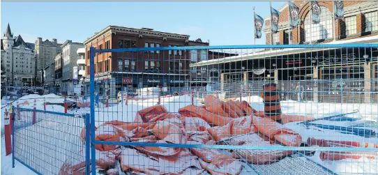  ?? JULIE OLIVER ?? The site of two homicides this year, the ByWard Market is also a maze of yellow caution tape and orange mesh as constructi­on of the Rideau Street LRT station and constructi­on at the George Street plaza have overtaken the area.