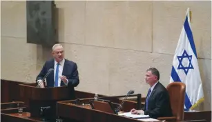  ?? (Knesset Spokespers­on) ?? BLUE AND WHITE leader Benny Gantz addresses the Knesset plenum on Monday, while Knesset speaker Yuli Edelstein listens.