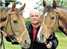  ??  ?? Nicholls with his horses Rudi’s Pet (left) and Pepperdine (right). He and his family lived in a caravan for several years while his stables were being constructe­d