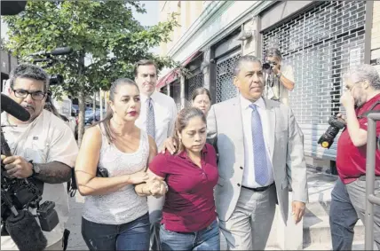  ?? Gabriella Angotti-jones / New York Times ?? Janey Pearl Starks, left, Yeni González and Rep. Adriano Espaillat, D-N.Y., walk toward the Cayuga Center in Harlem where González’s three children were put in foster care July 3 after being taken from her at the border.