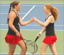  ?? FILE PHOTO ?? Plyouth’s Taylor Delp and Ellie Jojnes fist bump at doubles state in ‘22.