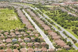  ?? William Luther / Staff file photo ?? Subdivisio­ns are seen in 2018 near Culebra Road outside Loop 1604 on the city’s expanding West Side. San Antonio City Council left the overall tax rate flat.