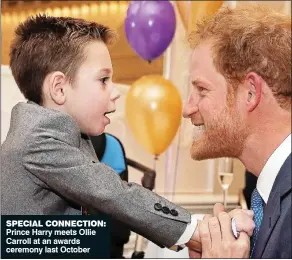  ??  ?? SPECIAL CONNECTION: Prince Harry meets Ollie Carroll at an awards ceremony last October