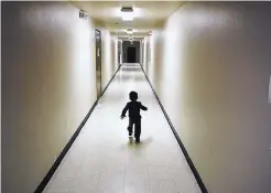  ?? GREGORY BULL/ASSOCIATED PRESS ?? An asylum-seeking boy from Central America runs down a hallway after arriving from an immigratio­n detention center at a shelter in San Diego. Eight immigrant families are demanding $6M in damages for trauma.