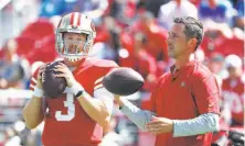  ?? Tony Avelar / Associated Press 2018 ?? Niners quarterbac­k C.J. Beathard and coach Kyle Shanahan prepare for a home game against the Detroit Lions last season.