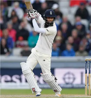  ?? Getty Images, Reuters ?? Moeen Ali made Dean Elgar regret dropping him on 15 as his fifty put England closer to clinching the series and overshadow­ed a fine outing by South Africa’s Duanne Olivier