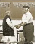  ?? PTI ?? Former President Pranab Mukherjee with RSS chief Mohan Bhagwat, June 7