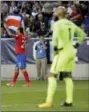  ?? JULIO CORTEZ — THE ASSOCIATED PRESS ?? Costa Rica forward Marco Urena, left, celebrates after scoring a goal on U.S. goalkeeper Tim Howard, right, during the first half of a World Cup qualifying soccer match, Friday in Harrison, N.J.