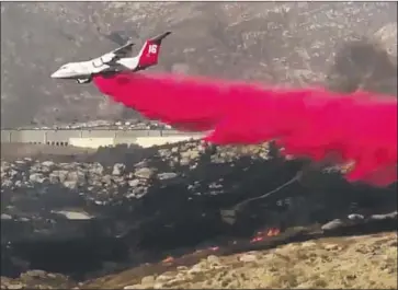  ?? Riverside Fire Department ?? THREE AIR TANKERS helped crews get the 250-acre Sycamore Canyon fire in Riverside fully contained Sunday, fire officials said. The Tenaja fire, which erupted Wednesday in Riverside County, is 56% contained.