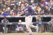  ?? Matthew Stockman / Getty Images ?? Brewers third baseman Mike Moustakas scores on a balk by the Rockies pitcher Scott Oberg in Game 3 of the NLDS on Monday.