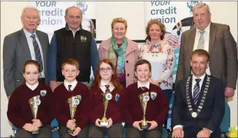  ?? Photo by Michelle Cooper Galvin ?? John Long Chairman Chapter 23 Credit Union (seated right) who presented 3rd prizes in the Chapter 23 Under 11 Schools Quiz to Jennifer Harrington, Rory O’Halloran, Zara McGrath and Liam Carroll of Glenderry National School with (back) Christy Killeen...