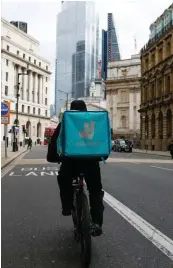  ?? BLOOMBERG ?? Deliveroo, among many other last-mile delivery service platforms, rely on gig-workers to deliver the goods to the consumers