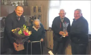  ?? ?? Michael Price outgoing chairman of Mitchelsto­wn GAA making a presentati­on to Life President Jim Skinner, along with current Chairman John Walsh making a presentati­on to Jim’s wife, Patricia.