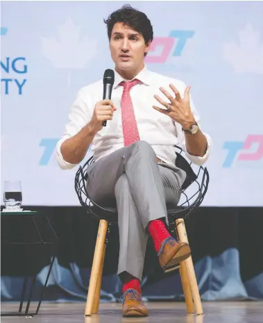  ?? ADRIAN WYLD / THE CANADIAN PRESS ?? Justin Trudeau — and his socks — didn’t impress the Australian prime minister at a 2017 leaders summit in Vietnam.