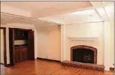  ??  ?? Coffered ceilings accent the family room, which has a fireplace with raised brick hearth and woodbeam mantel.