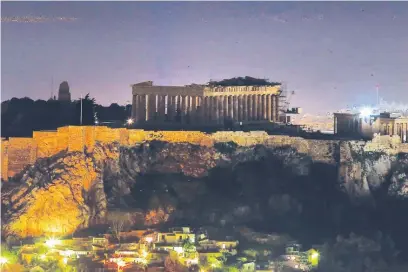  ?? (AP) ?? THE temple of the Parthenon on the Acropolis Hill is blacked out during the Earth Hour in Athens, Greece.