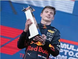  ?? (AFP) ?? Red Bull Racing's Max Verstappen celebrates on the podium after winning the Miami Grand Prix