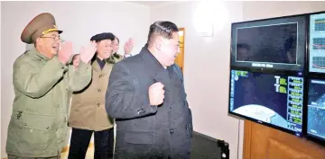  ??  ?? Kim is seen as the newly developed interconti­nental ballistic rocket Hwasong-15’s test was successful­ly launched, in this undated photo released by North Korea’s Korean Central News Agency (KCNA) in Pyongyang. — Reuters photo