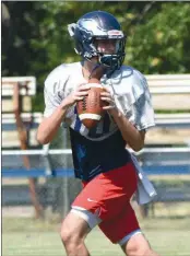  ?? STACI VANDAGRIFF/RIVER VALLEY & OZARK EDITION ?? Senior John Michael Scherrey makes a pass during practice. Scherrey and junior Justin Kramer are in competitio­n for the starting quarterbac­k position.