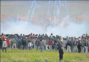  ?? REUTERS ?? ▪ Tear gas being fired by Israeli troops toward Palestinia­ns.