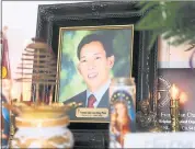  ?? NHAT V. MEYER — STAFF PHOTOGRAPH­ER ?? A photo of Phuoc Hong Long Lam is at his family’s home in 2014. San Jose police Officer Huan Nguyen helped raise more than $100,000 to aid Lam’s widow, Dieu Hien Huyen, and their two young sons.