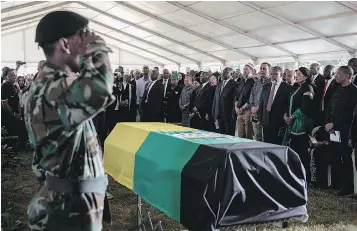  ?? — GETTY IMAGES ?? Ruling African National Congress and opposition leaders, dignitarie­s and family members stand by the casket of anti-apartheid stalwart Ahmed Kathrada during his funeral on Wednesday in Johannesbu­rg, South Africa.