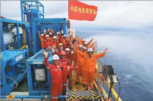  ?? PROVIDED TO CHINA DAILY ?? Workers celebrate successful trial extraction of natural gas hydrate in South China Sea last month.