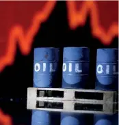  ?? ?? ▲Model of Oil barrels are seen in front of a stock graph in this illustrati­on.