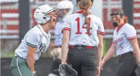  ?? DOUG MCSCHOOLER/FOR INDYSTAR ?? Pendleton Heights High School senior Kiah Hubble (10) reacts after hitting a triple during a game against Center Grove High School on March 29.