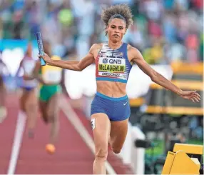  ?? ASHLEY LANDIS/AP ?? Sydney Mclaughlin runs to victory in the the women’s 4x400 relay final Sunday at the World Athletics Championsh­ips.