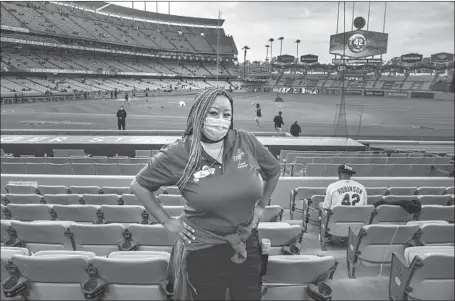  ?? Gina Ferazzi Los Angeles Times ?? SACHI HAMILTON, great-niece of Jackie Robinson, is an usher, the same position her mother, Kathy Robinson Young, held in the 1980s.