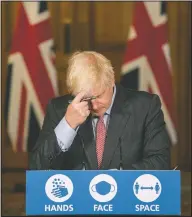  ?? (File Photo/AP/Jack Hill) ?? Britain’s Prime Minister Boris Johnson gestures during a coronaviru­s briefing in September in Downing Street in London.