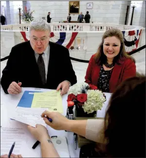  ?? Arkansas Democrat- Gazette/ STATON BREIDENTHA­L ?? Little Rock businessma­n Curtis Coleman with his wife, Kathryn, fi les Monday at the state Capitol to run as a Republican for the U. S. Senate. Coleman will challenge incumbent Sen. John Boozman, R- Ark., in the primary.