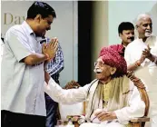  ?? — ANI ?? CM Arvind Kejriwal greets Mahashay Dharampal Gulati of MDH group during an event organised by Chamber of Trade and Industries in New Delhi on Sunday.