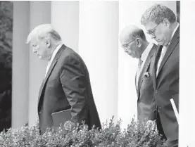  ?? MARK WILSON/GETTY ?? President Donald Trump, left, Secretary of Commerce Wilbur Ross and Attorney General William Barr walk into the Rose Garden to make a statement on the census Thursday.