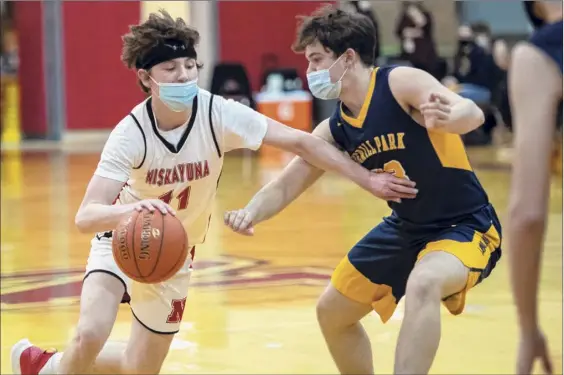  ?? Photos by James Franco / Special to the Times Union ?? Niskayuna guard Jack Allen makes a move to try to go around Averill Park’s Aiden Mccue during their Suburban Council matchup at Niskayuna High School on Saturday. Allen made a pair of 3-pointers in a fourth-quarter run to help the Silver Warriors pull away. He finished with 10 points.