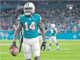  ?? JIM RASSOL/STAFF PHOTOGRAPH­ER ?? Jarvis Landry led the NFL in receptions, scored a career-high nine TDs and was 13 yards shy of becoming the first Dolphin to record three consecutiv­e 1,000-yard receiving seasons.