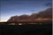  ?? ROBERT BROWMAN — THE ALBUQUERQU­E JOURNAL ?? Smoke from the Calf Canyon/Hermits Peak Fire drifts over Las Vegas, N.M., on Saturday.
