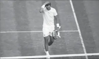  ?? CLIVE BRUNSKILL, GETTY IMAGES ?? A dejected Rafael Nadal walks off the court after losing to Gilles Muller at Wimbledon on Monday in five sets.