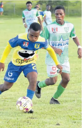  ?? PHOTO BY ASHLEY ANGUIN ?? Rusea’s High’s Kimarly Cope (left) getting away from Frome Technical High’s Akeem Kongal during an Issa/digicel dacosta Cup football match at the Rusea’s Sports Complex on Tuesday, September 27. Frome won 3-0.