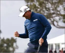  ?? MICHAEL OWENS — GETTY IMAGES ?? Padraig Harrington of Ireland reacts after making a birdie putt on the 18th hole to win the Hoag Classic at Newport Beach Country Club on Sunday.