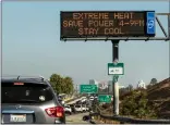  ?? KARL MONDON — BAY AREA NEWS GROUP ?? Extreme heat advisory signs are displayed on Highway 87message boards in San Jose on Thursday.