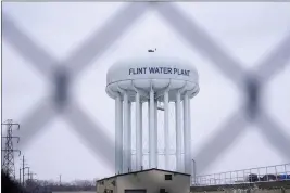  ?? CARLOS OSORIO — THE ASSOCIATED PRESS FILE ?? The Flint water plant tower is seen, Thursday in Flint, Mich. The Michigan Supreme Court has ruled that charges related to the Flint water scandal against former Gov. Rick Snyder, his health director and seven other people must be dismissed. The justices found Tuesday that the judge had no authority to issue the indictment­s. It’s an astonishin­g defeat for Attorney General Dana Nessel.