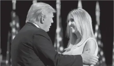  ?? Photo: AFP ?? Republican presidenti­al candidate Donald Trump walks onstage after his daughter, Ivanka Trump (right), introduced him on the fourth day of the Republican National Convention on Thursday at the Quicken Loans Arena in Cleveland, Ohio.