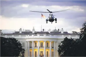  ?? J. SCOTT APPLEWHITE AP ?? President Donald Trump arrives back at the White House aboard Marine One on Monday after being treated for COVID-19 at Walter Reed National Military Medical Center.