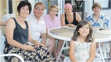  ??  ?? Support from family and friends became vital to Licia Corbella during her cancer treatments and recovery. Here sister Flavia and niece Sabrina visited from Vancouver, spending time with Licia, her husband Stephen, and their sons Tyrone and Nolan.