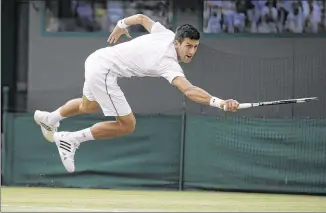  ?? ALASTAIR GRANT / ASSOCIATED PRESS ?? Novak Djokovic lunges for a return during his comeback victory over Kevin Anderson in a match that was suspended Monday. Djokovic is back quickly today to face Marin Cilic.